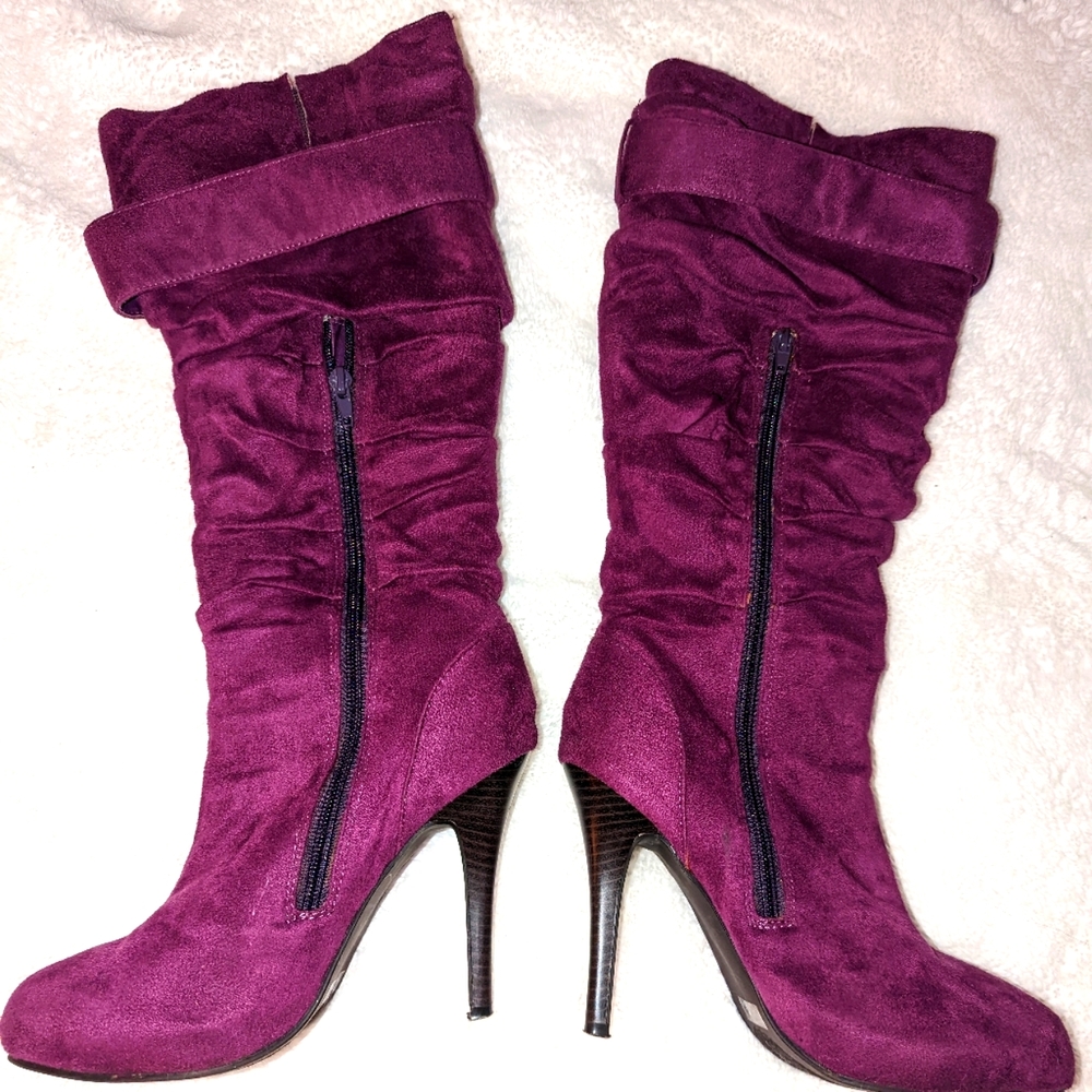 Purple high heel boots with buckle on one side for design and side zippe